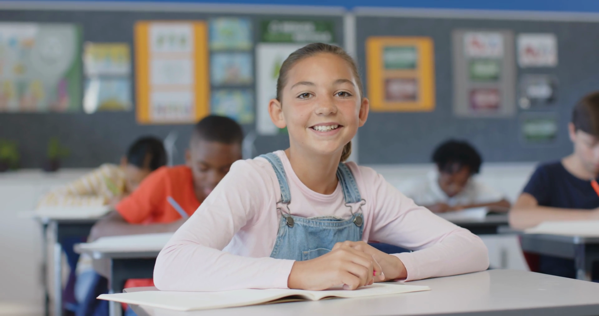 In School Girl Smiling Sitting At Desk With Stock Footage SBV-352094598 ...