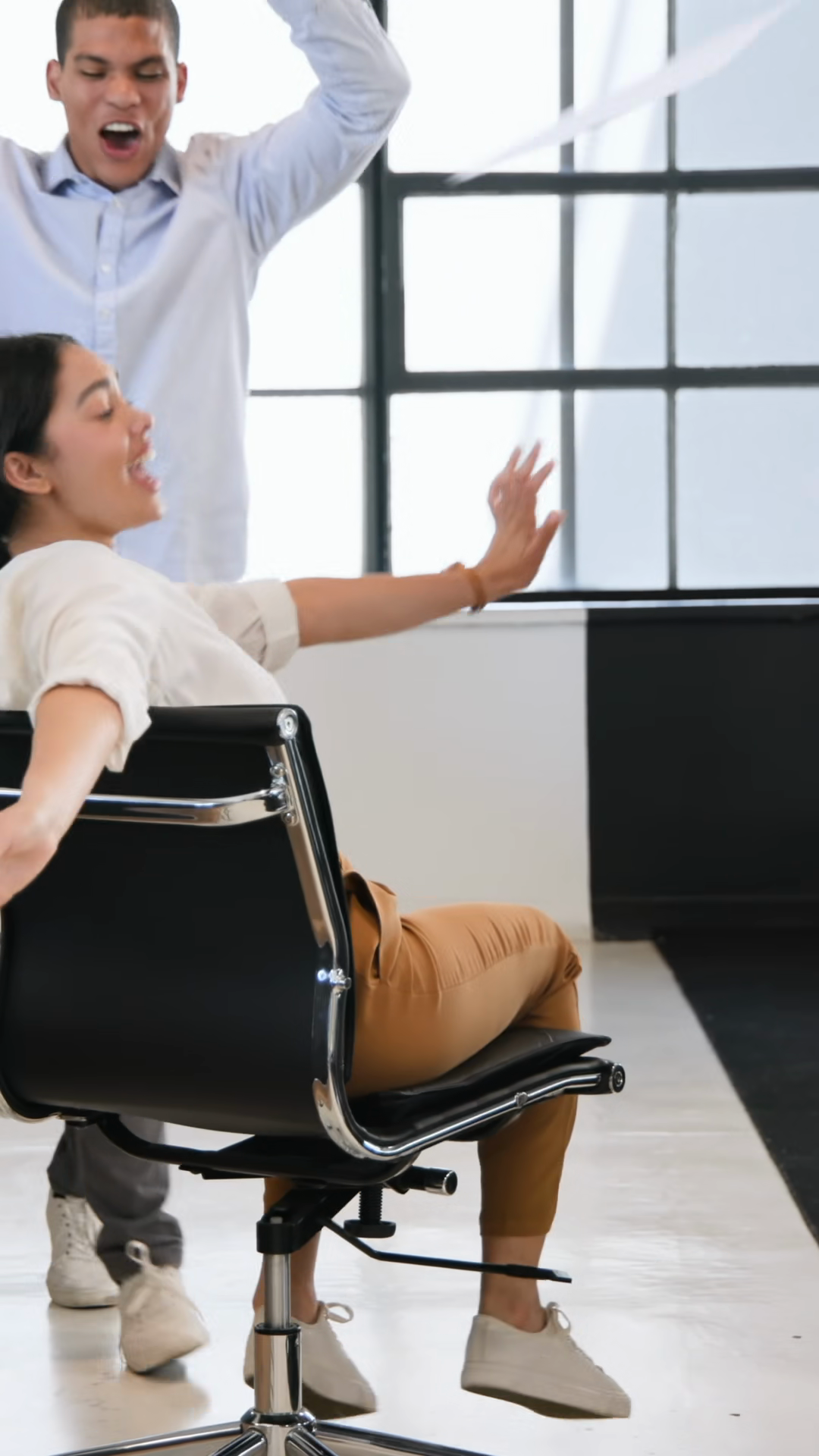 Vertical Video: Male Coworker Pushing Chair Stock Footage SBV-353914691 ...