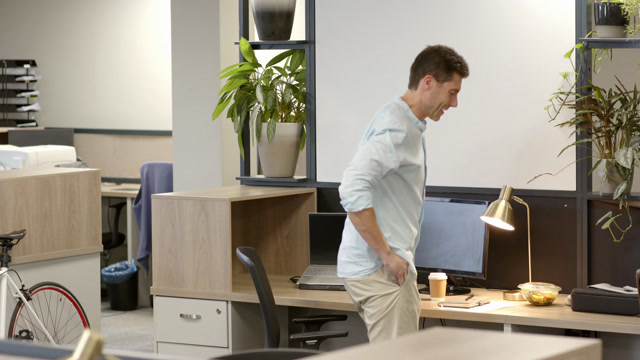 Man Walking With Computer In Office Stock Footage: Royalty-Free Video ...