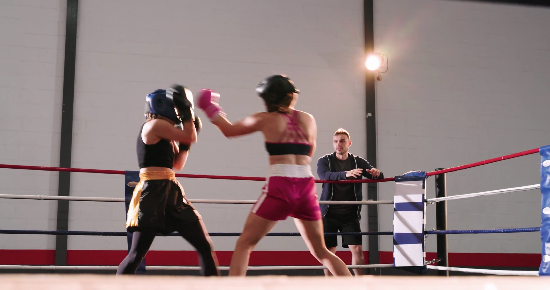 Coach Signaling Two Female Boxers Advancing Stock Footage SBV-352816879 ...