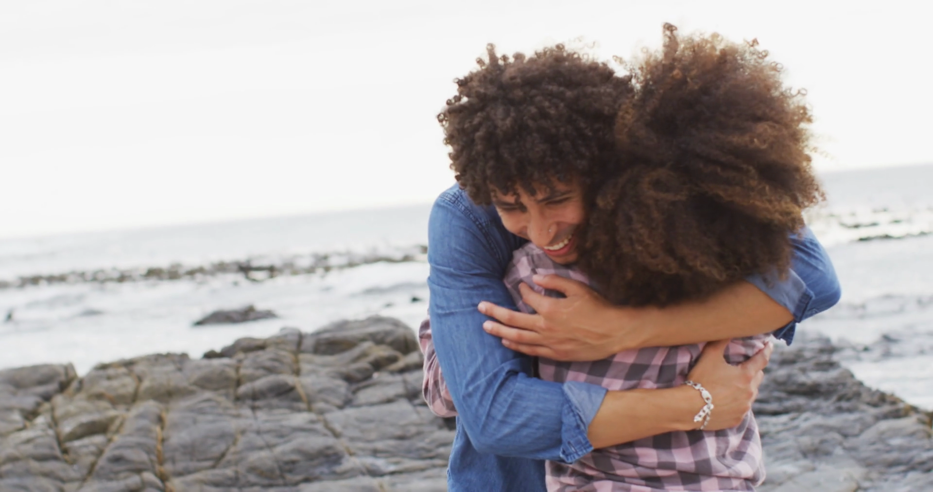African American Couple Hugging On Rocks Stock Footage SBV-348497766 ...