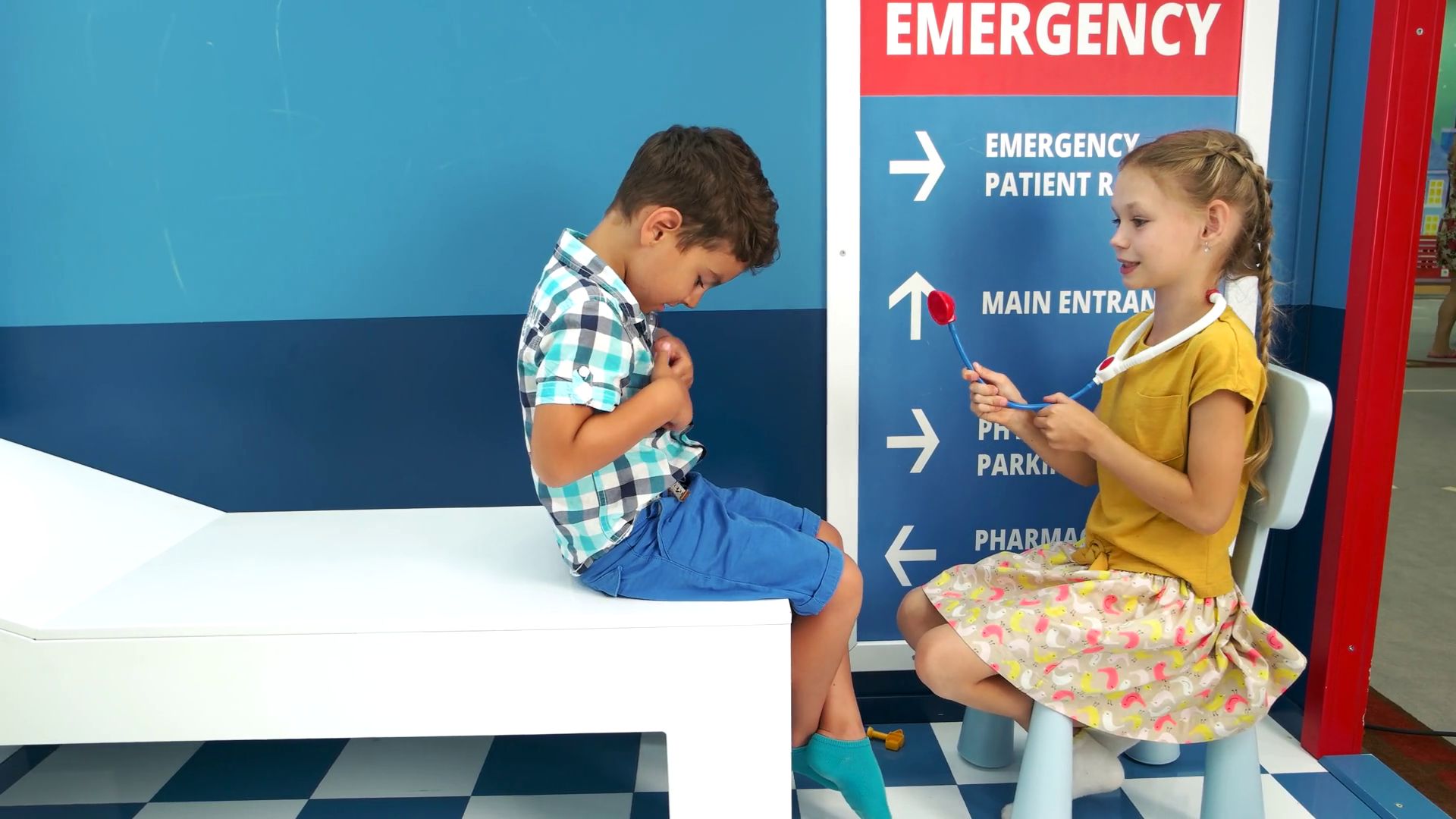 Two children playing doctor in playroom. Little girl doctor examining boy patient with toy stethoscope. Childrens role play center. Stock Video Footage 00:19 SBV-335531681 - Storyblocks              