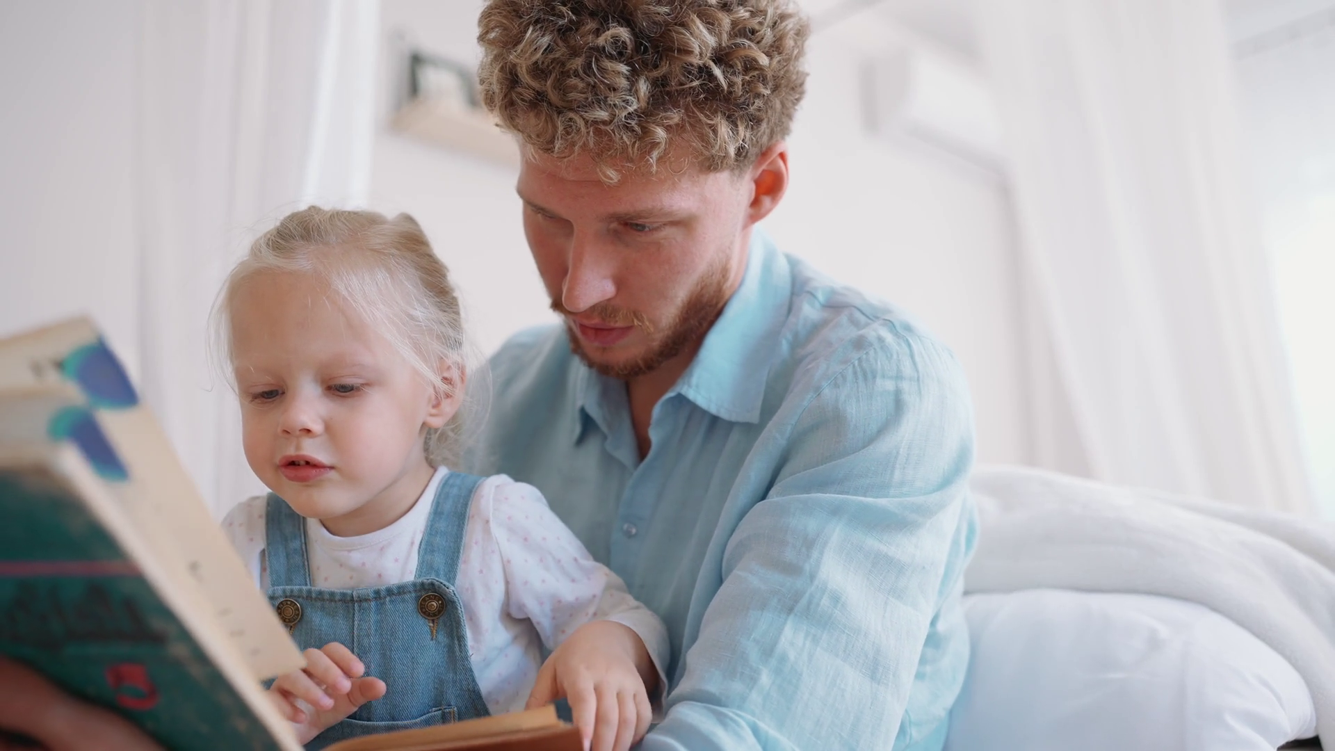 Serious Blond Father Daughter Reading Book Stock Footage SBV-352468411 ...