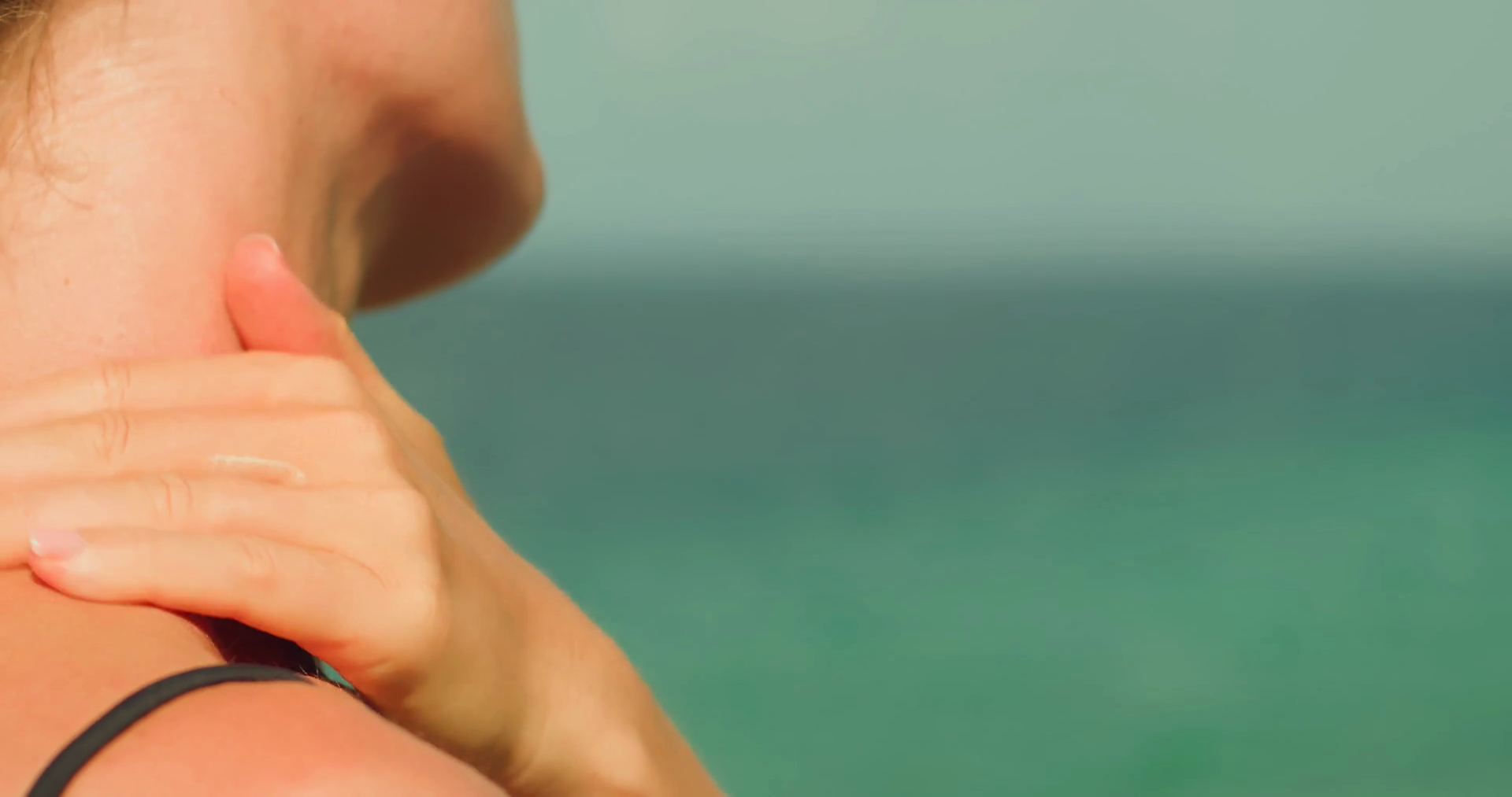 Applying Sunscreen With Ocean Backdrop Stock Footage SBV-348922705 ...