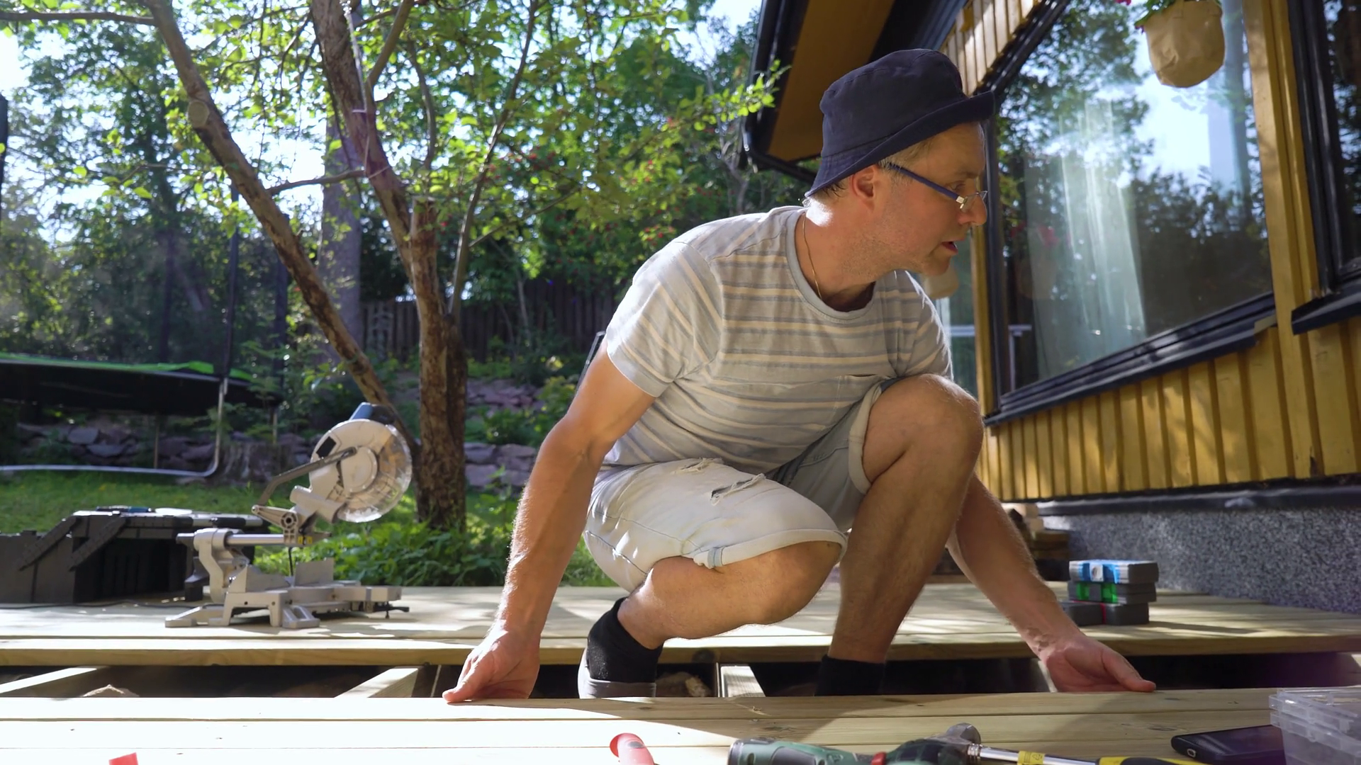 A Man Builds Wooden Terrace In Backyard Of Stock Footage SBV-351940158 ...