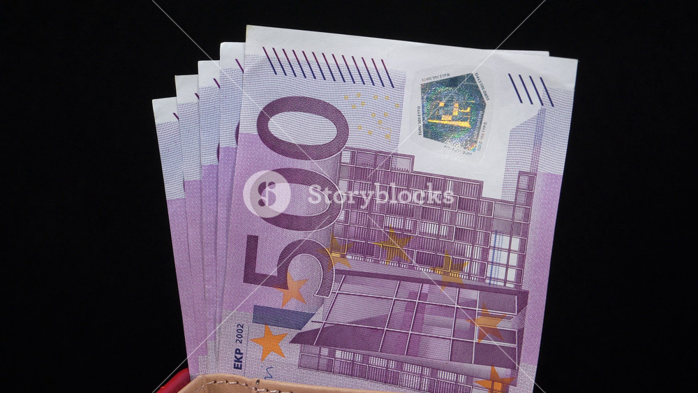 European money. Cash, finance, savings, wealth. Two and a half thousand euros in five 500 euro banknotes. Euro banknotes, EURO. 500 euro banknotes in wallet