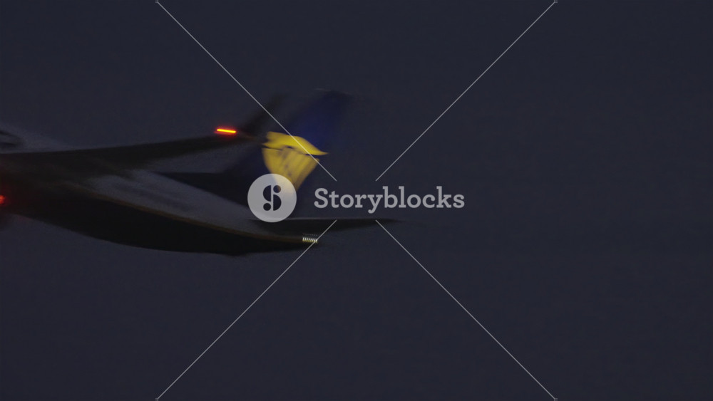TOULOUSE, FRANCE - JULY 1, 2026: Ryanair Boeing 737 climbing out after takeoff against a dark evening sky, Ryanair is the largest low cost