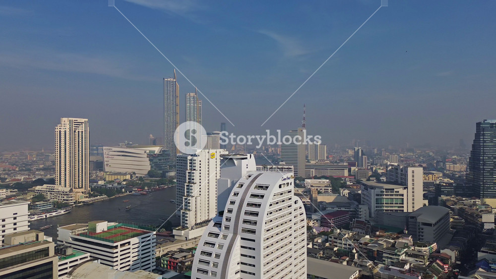 BANGKOK, THAILAND - JANUARY 21, 2025: Aerial view of Bangkok cityscape with Lumpini park and modern skyscrapers, panorama 4k