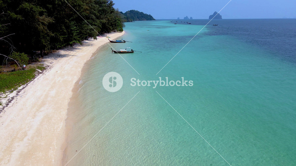 Stroll along the soft sands of Koh Kradan, feeling the warm sun and the gentle breeze. Discover the beauty of clear blue waters, lush