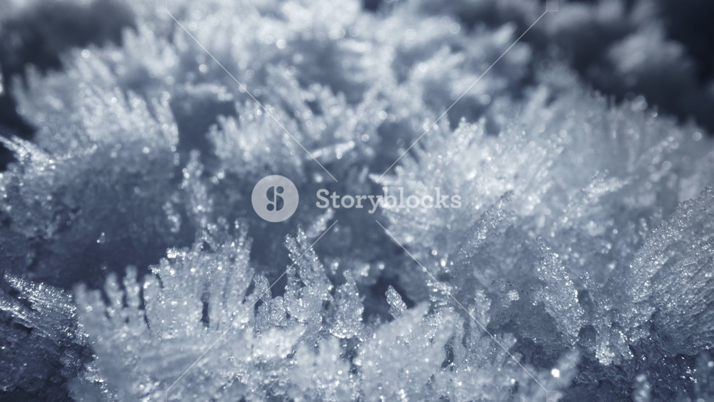 Snow cover. Super macro sliding shot of snow crystal, snowflakes. Camera moves through bizarre frozen flakes of snow. Ice formations, frost