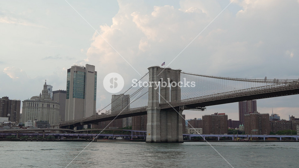 NEW YORK, USA - JULY 12, 2025: A stunning and breathtaking view of the iconic Brooklyn Bridge framed against the majestic New York City