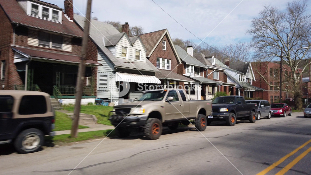 A three-quarter side profile forward view driving in a residential district of the middle-class town of Aliquippa, PA - about 20 miles north of Pittsburgh.