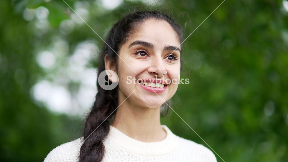 Close up face woman enjoying nature taking deep breaths of fresh air standing among trees in forest or park. Outdoors closing Female girl Inhaling and Exhaling eyes calm rest and stress relief Closeup