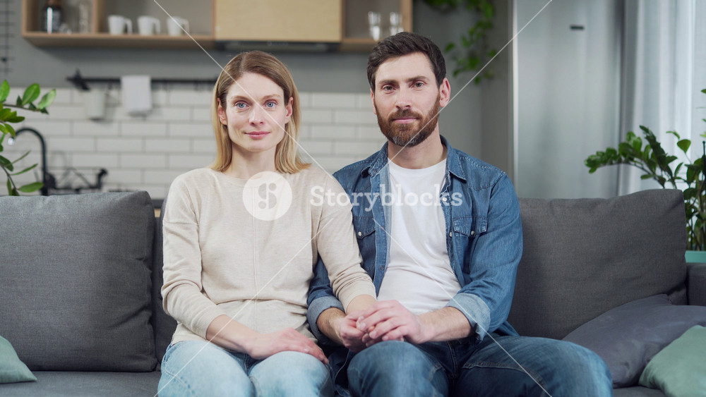 Webcam view of married couple looking at the camera and listen to useful advices of family psychologist at online counselling session Family understood and solved problems with a qualified specialist