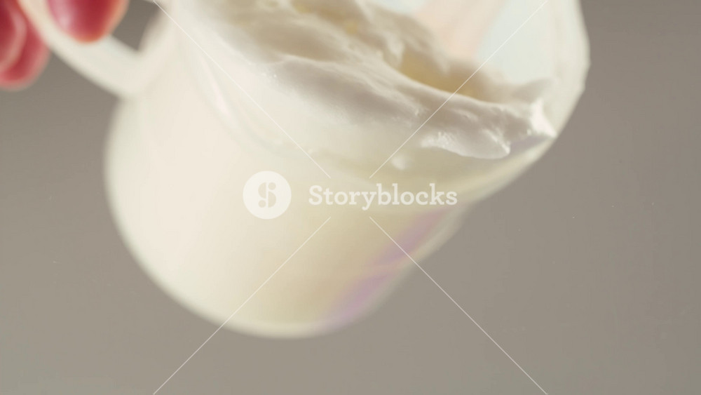 Pouring mayo white creamy sauce close-up in cafe restaurant. Cooking fast food fries with mayonaise sauce. Fast and junk food concept.
