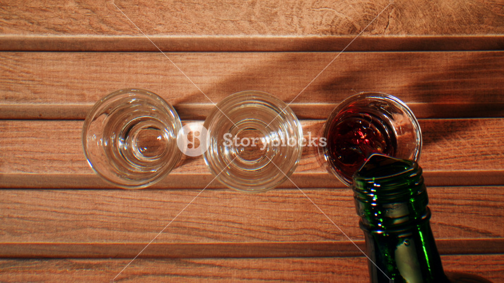 Pouring of red bitter, Cognac, whisky, Campari, Aperol, Cherry Vermouth, spanish wine drink, Americano bitter, sweet vermouth and soda water