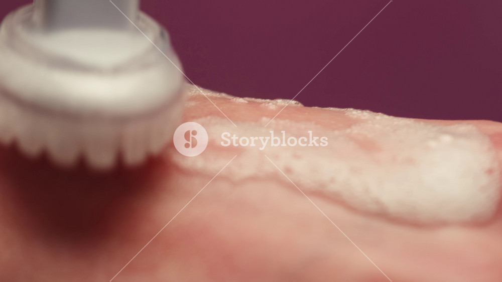 Woman apply cream for hands skin, Close-up of hands with exfoliating cream, demonstrating effective skin care, soft cream foam.