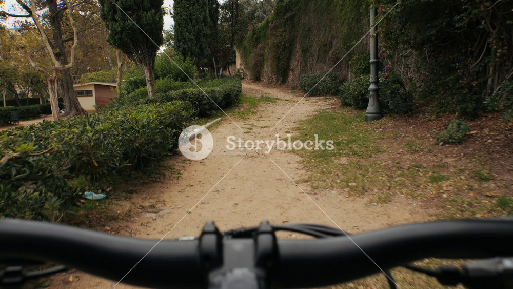 Pov riding bicycle bike, point of view closeup of a hand on a bicycle handle a sunny day, highlighting the joy of cycling in spain