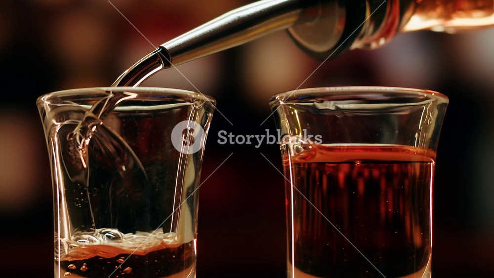 Pouring of red bitter, Cognac, whisky, Campari, Aperol, Cherry Vermouth, spanish wine drink, Americano bitter, sweet vermouth and soda water