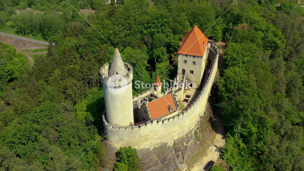 Aerial view of medieval castle Kokorin nearby Prague in Czechia. Central Europe. Medieval gothic castle Kokorin, Kokorinsko protected landscape area in Czech Republic. Medieval gothic castle Kokorin.