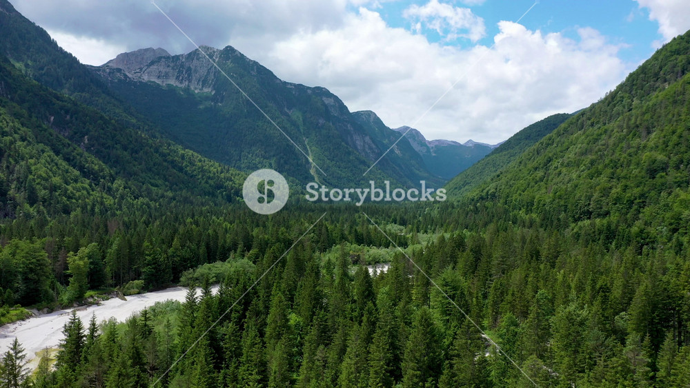 View to Julian Alps mountains above Predil lake in Italy with small lake. Predil Lake, Friuli Italy / (Lago del Predil), beautiful alpine lake in north Italy near the Slovenian border, Italy.