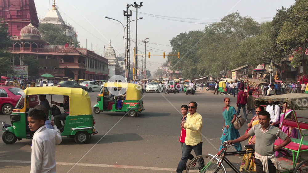 Delhi, India - November 20, 2015: Crowded and noisy street in Old Delhi crammed with vehicles and people busy with their daily activities