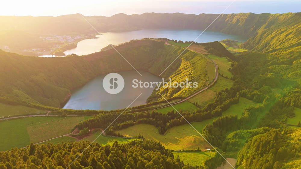 Sete Cidades Caldera at Sunset. Blue Lake and Santiago Lake. Forest and Hills. Azores, Sao Miguel Island. Portugal. Aerial View. Drone Moves