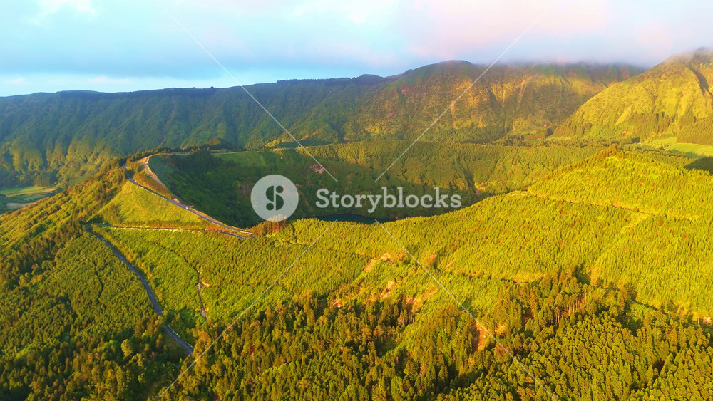 Lake Santiago. Sete Cidades Caldera at Sunset. Lush Green Hills. Azores, Sao Miguel Island. Portugal. Aerial View. Drone Moves Forward