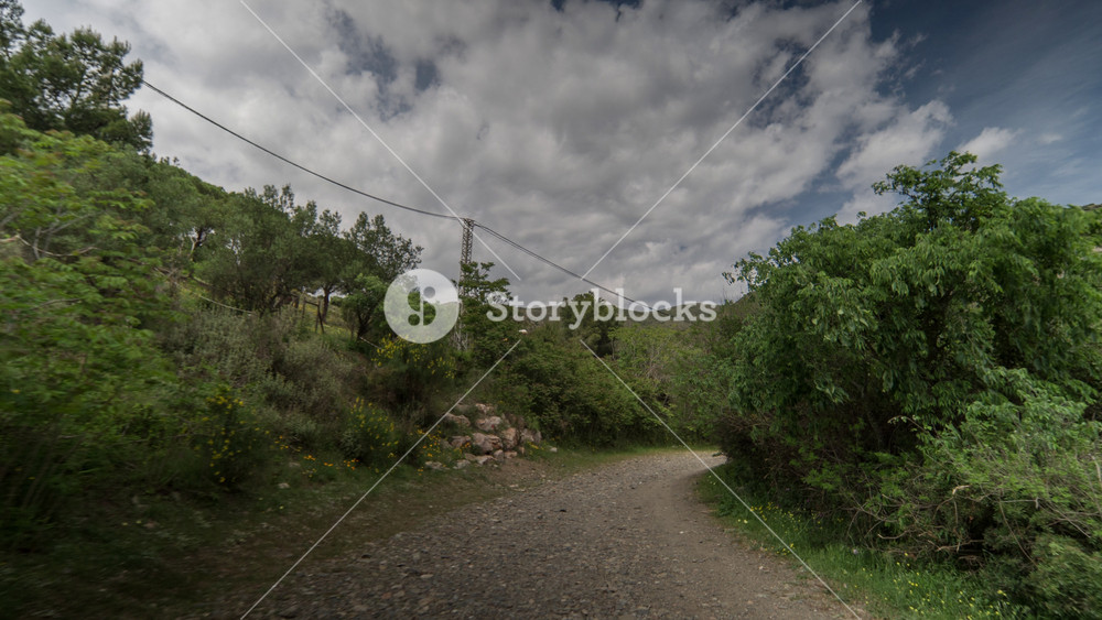 POV travelling shot of the cami de ronda de Roses coastline in catalunya, spain shot from the front of an off road vehicle