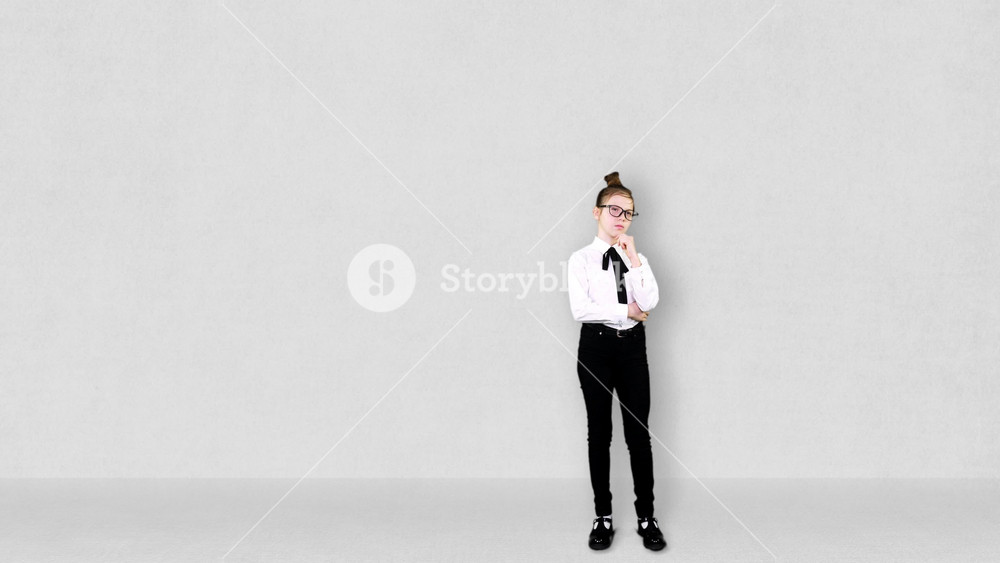 Smart Young Teenager girl pretends to be a businessman with successful idea. growing drawn graphics background. Imagination, Education, start up and business idea concept