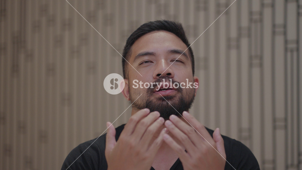 Southeast Asian Muslim Man with Black Shirt Salah Salat Zikr Holy Quran Reading Islam Prayer Islamic Ritual in Bed Room