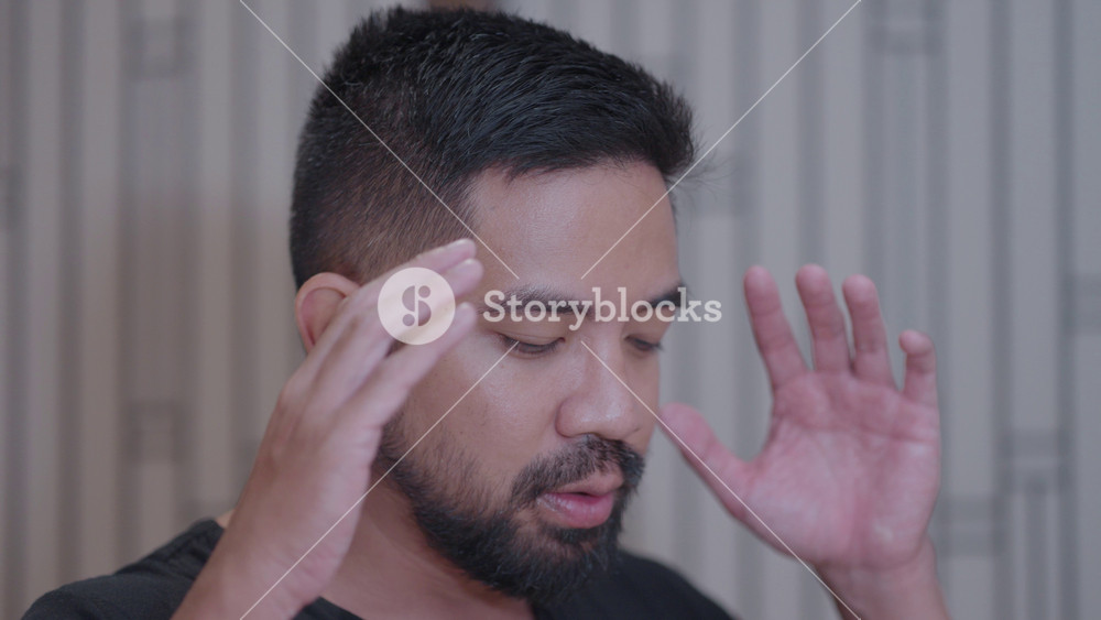Southeast Asian Muslim Man with Black Shirt Salah Salat Zikr Holy Quran Reading Islam Prayer Islamic Ritual in Bed Room