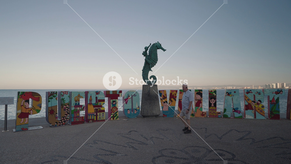 Puerto Vallarta, Mexico - November 1, 2024: The Boy on the Seahorse El niño sobre el caballito de mar sculpture by Rafael Zamarripa located on Puerto Vallarta's Malecón Jalisco Mexico