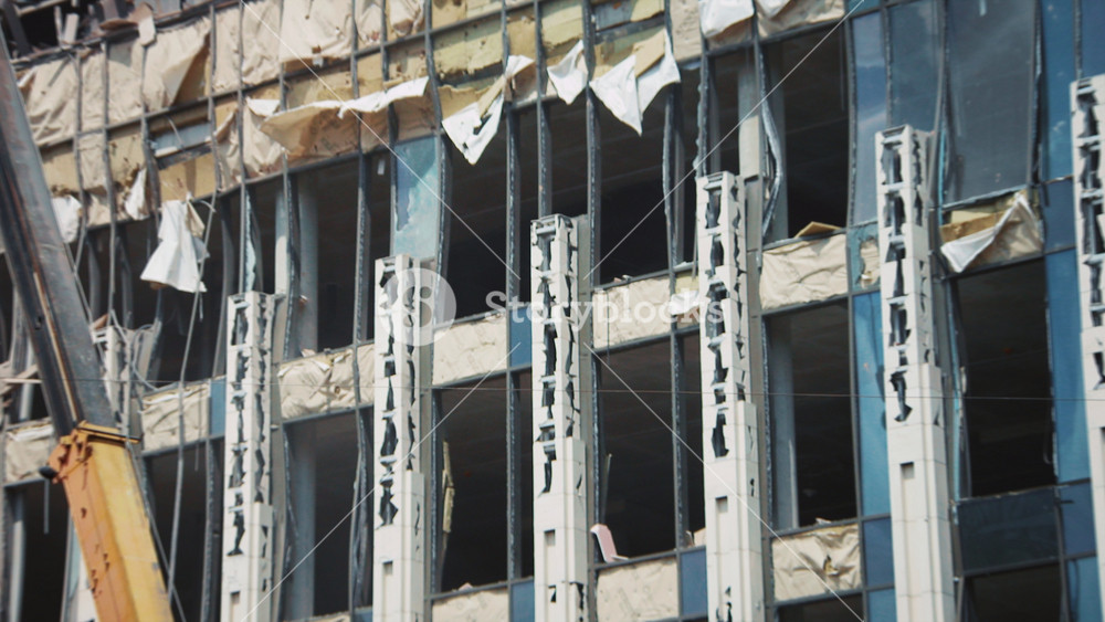 Shot of destroyed supermarket after night of shelling of city. Destroyed building with broken windows after air raid. Ballistic missiles