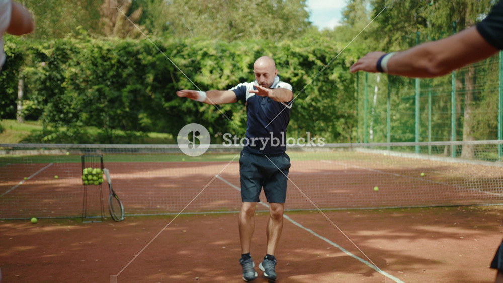 Sporty players warm up jumping before a game of tennis with trainer success match training course exercise fitness man woman athlete fun