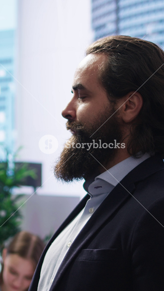 Vertical video Portrait of happy financial advisor meeting with clients to recommend financial products and investments such as stocks and