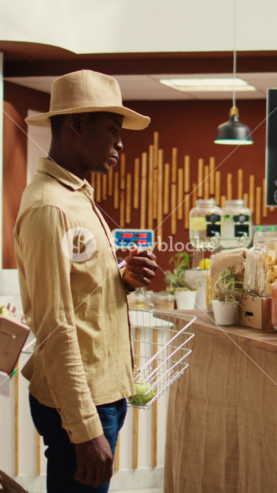 Vertical Video African american buyer visiting local farmers market to shop for organic produce and homemade nonpolluting pantry items
