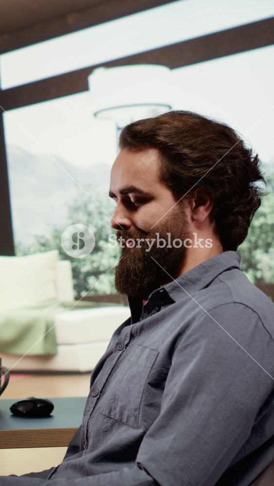 Vertical Video Successful billionaire sitting at his desk in luxury forest villa, relaxed rich person investing money in business. Wealthy