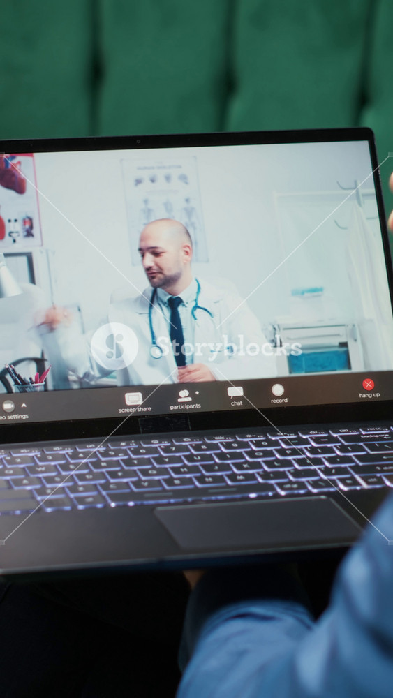 Vertical Video Male pensioner at home during online telemedicine consultation with medic, ensuring correct dosage of pills treatment. Doctor