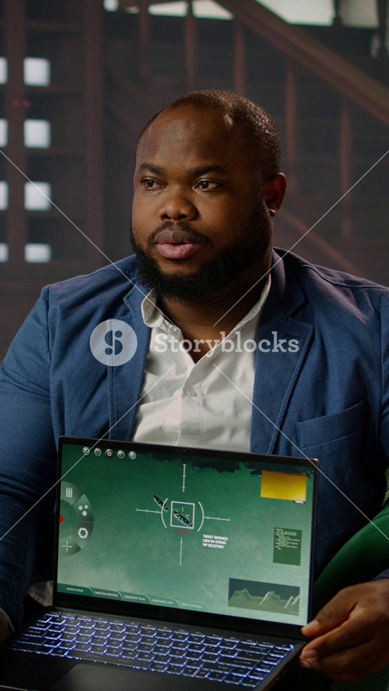 Vertical Video African american government spy monitoring satellite footage to gather data, reviewing important surveillance for the CIA