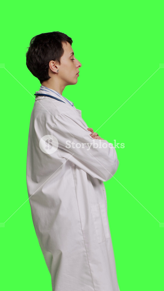 Profile Woman medic posing with arms crossed in a white coat, feeling confident and successful with her medical career and expertise. Doctor
