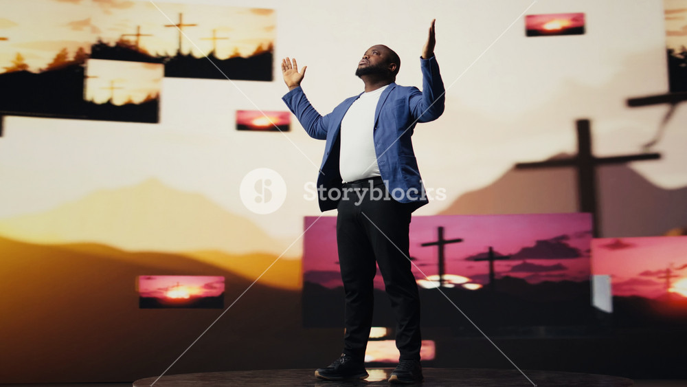 Black spiritual adult meditating on faith and serenity in a pose of worship, praising Jesus Christ. Crosses on the background symbolizes