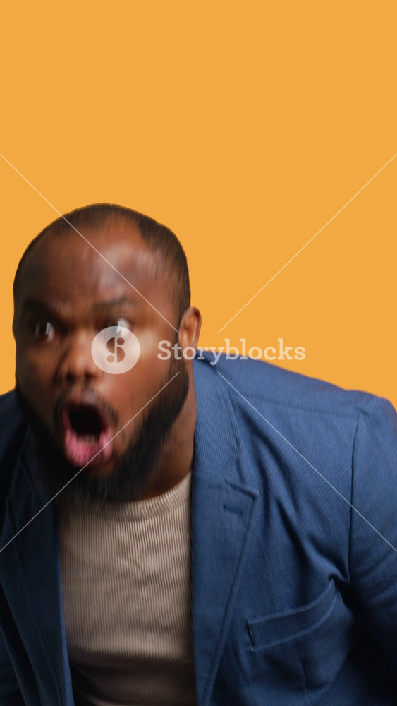 Vertical video Sports fan watching in disbelief match broadcast after own team fails to score, ready to switch channel. Man frustrated with