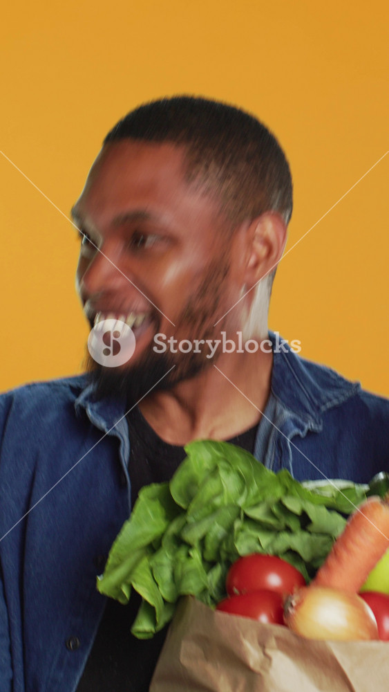 Vertical Video Young person staying in line at the local farmers market and talking to clients, advocating for zero waste sustainable