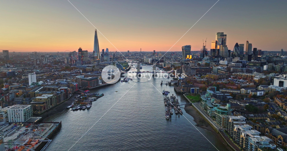 Scenic aerial view of London City skyline at sunset. Featuring iconic landmarks like The Shard. Tower Bridge. And the financial district