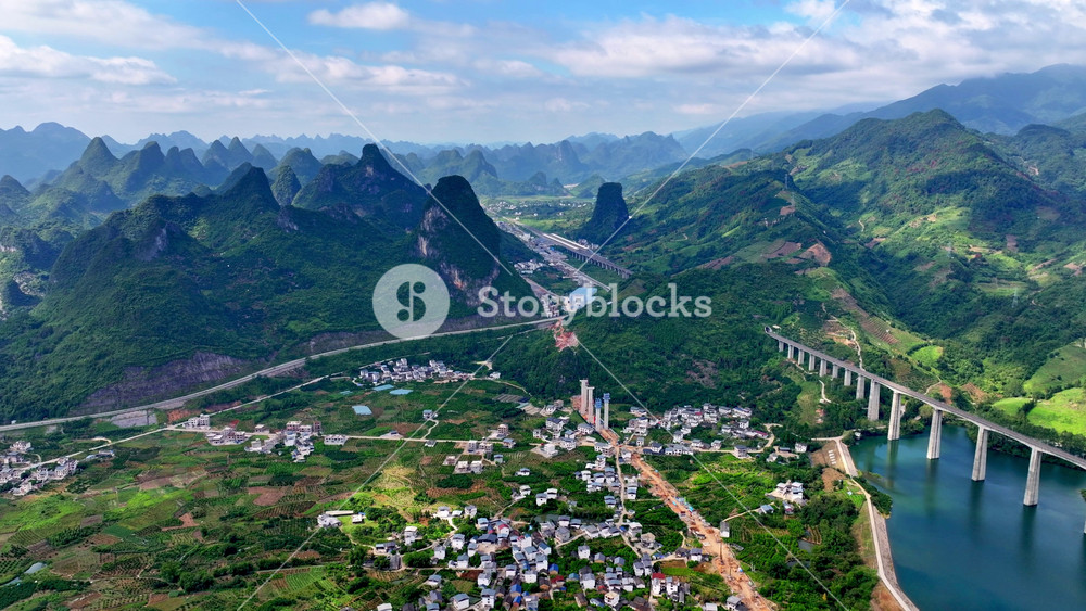 Aerial View of China Unique Mountain Landscape. Chinese Green Valleys and Quiet Villages. Serene and Expansive Look Beautiful Asian Region