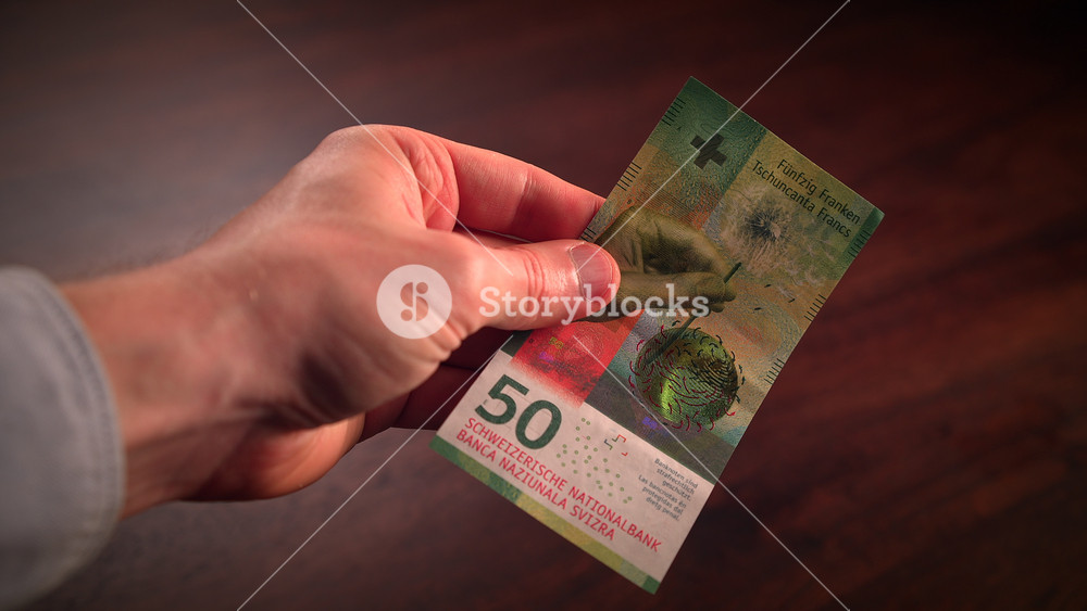 Detailed Closeup of Colorful Swiss Franc Bills Appearing One After Another. Switzerland and Liechtenstein National Currency. Cash Money