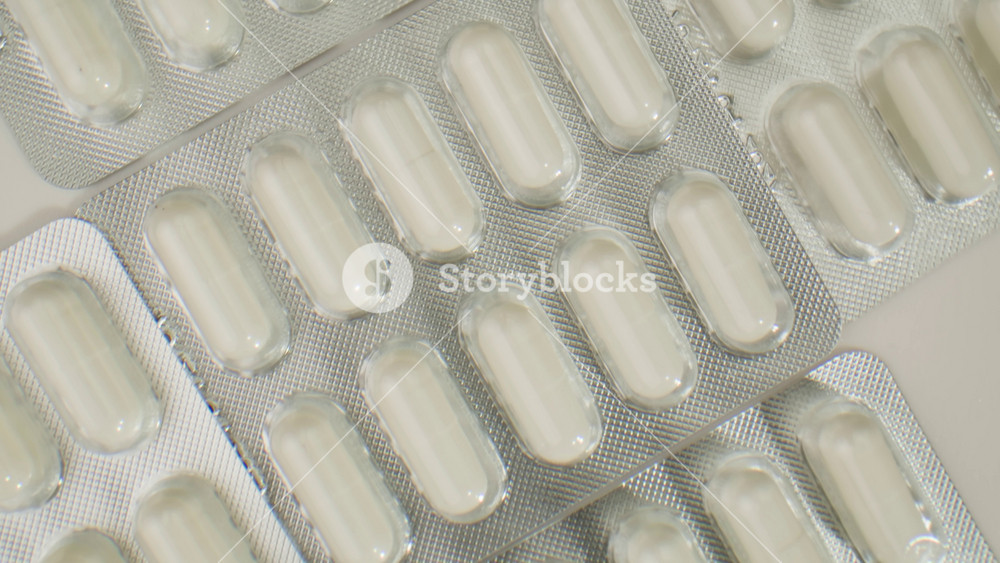 Pills and vitamins macro, Close up view of womans hands holding plenty of different drugs. Painkillers and antibiotics. Healthcare and