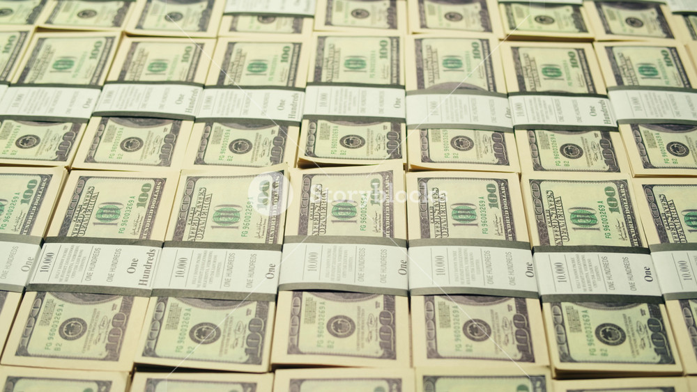 Stacks of cash dollars and euro, Banknotes counting, Specialised police officer Counting dollar euro banknotes in crime lab with machine