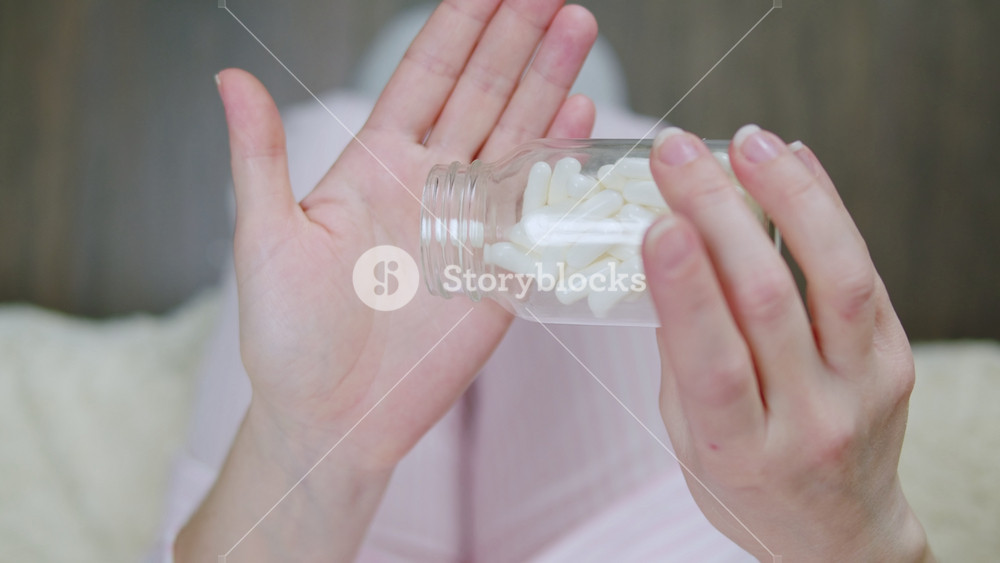 Pills and vitamins macro, Close up view of womans hands holding plenty of different drugs. Painkillers and antibiotics. Healthcare and